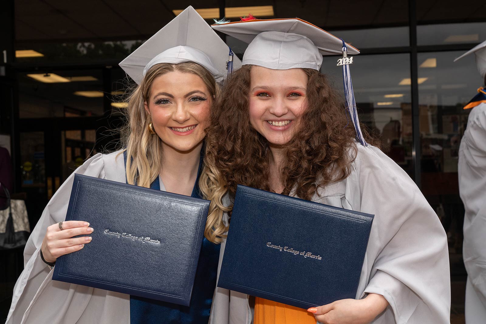 Two female graduates at commencement