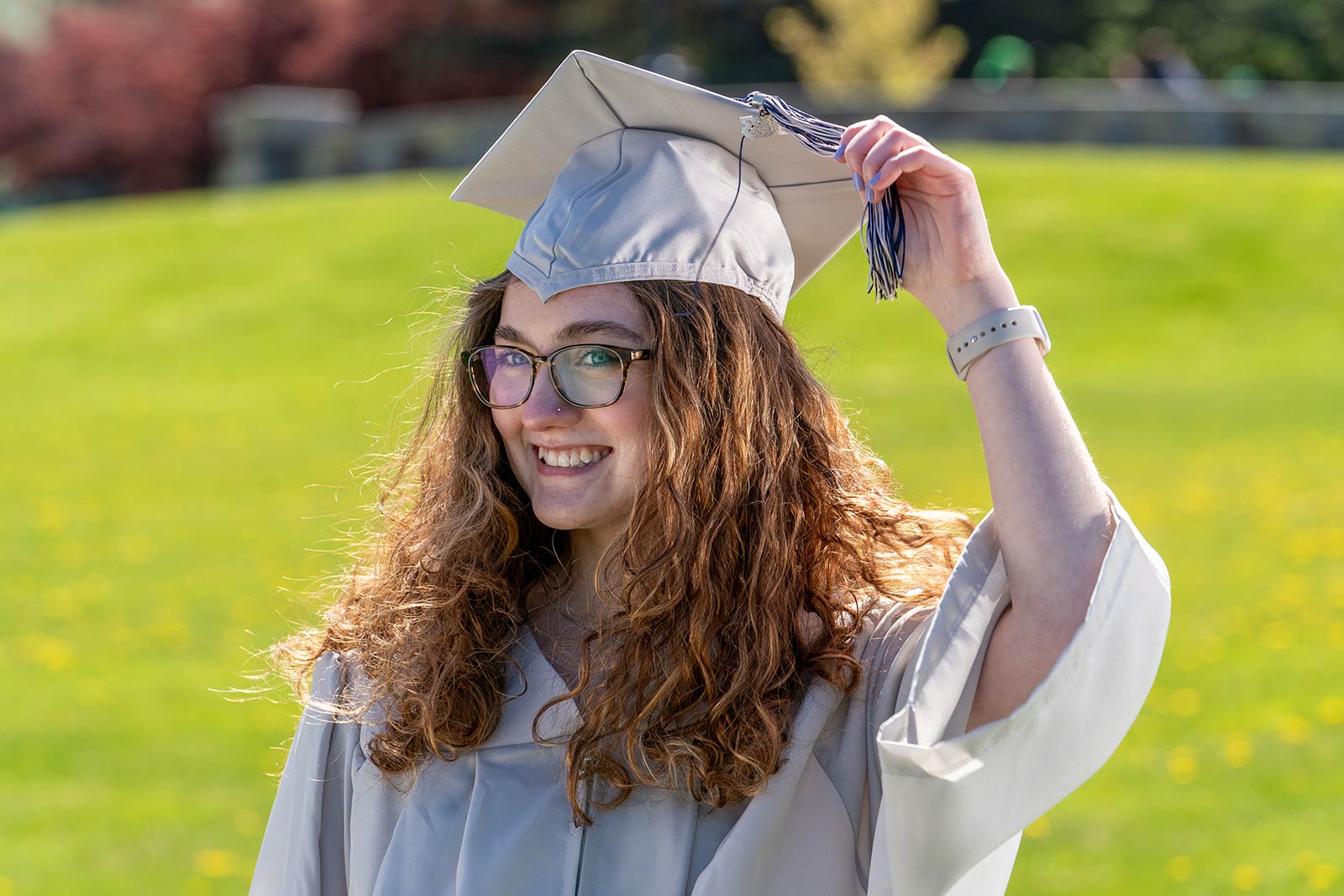 CCM graduate wearing cap and gown