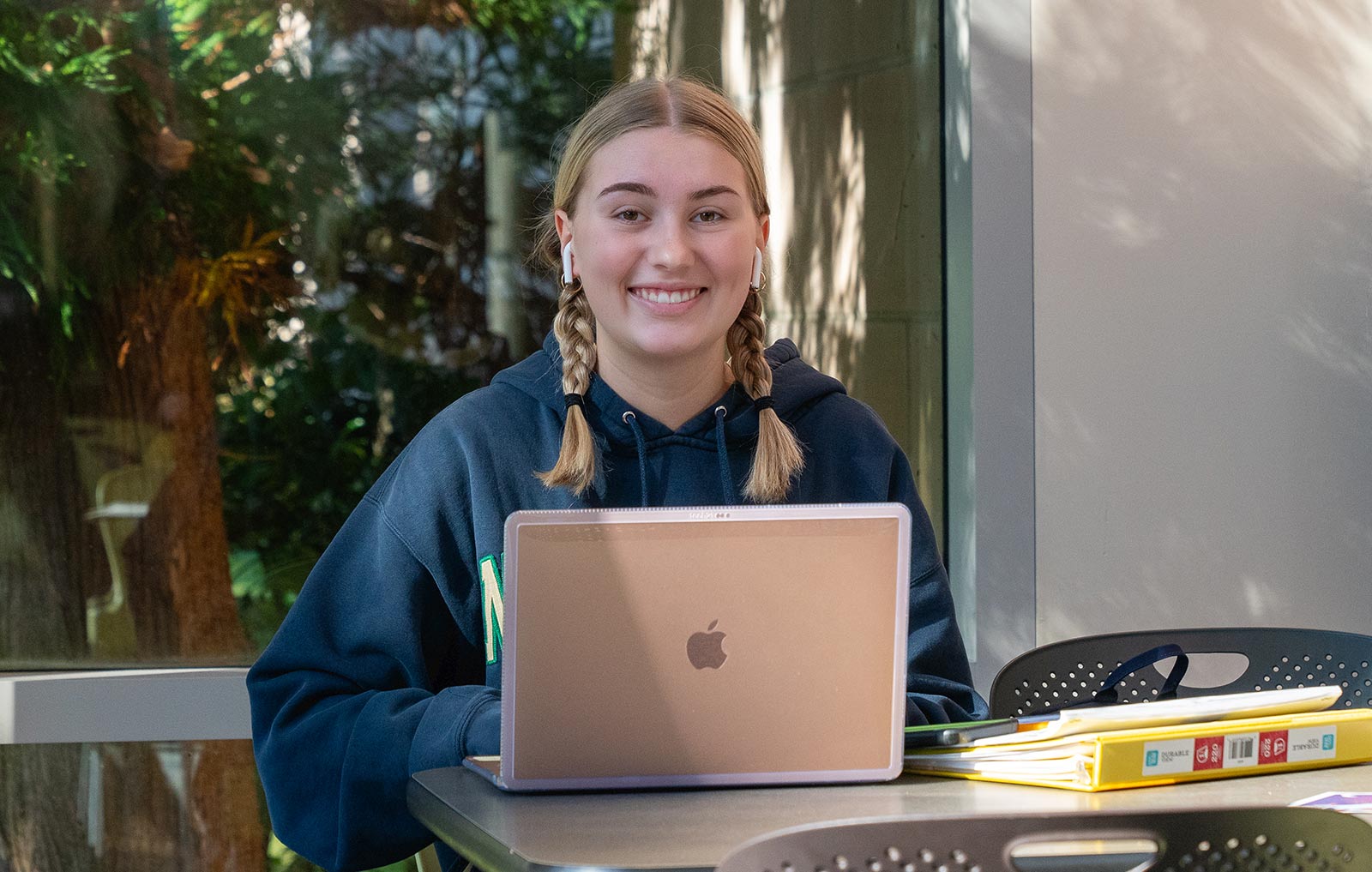 Female student working on computer in student center
