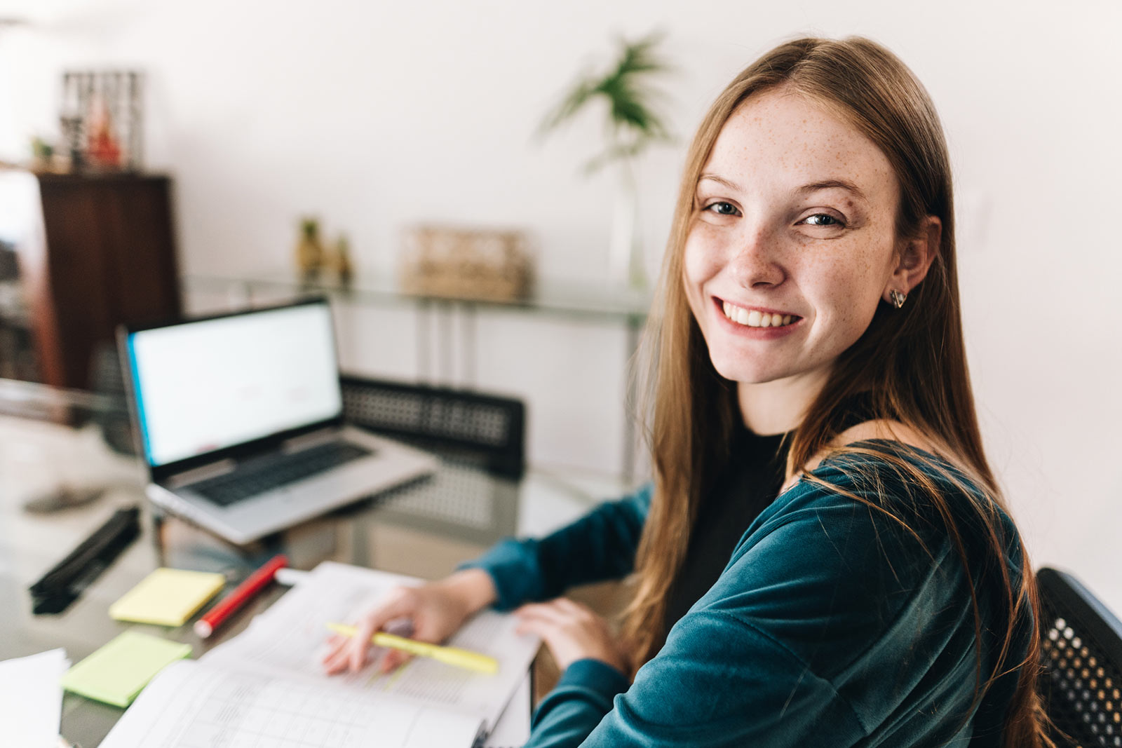 Young woman working at table